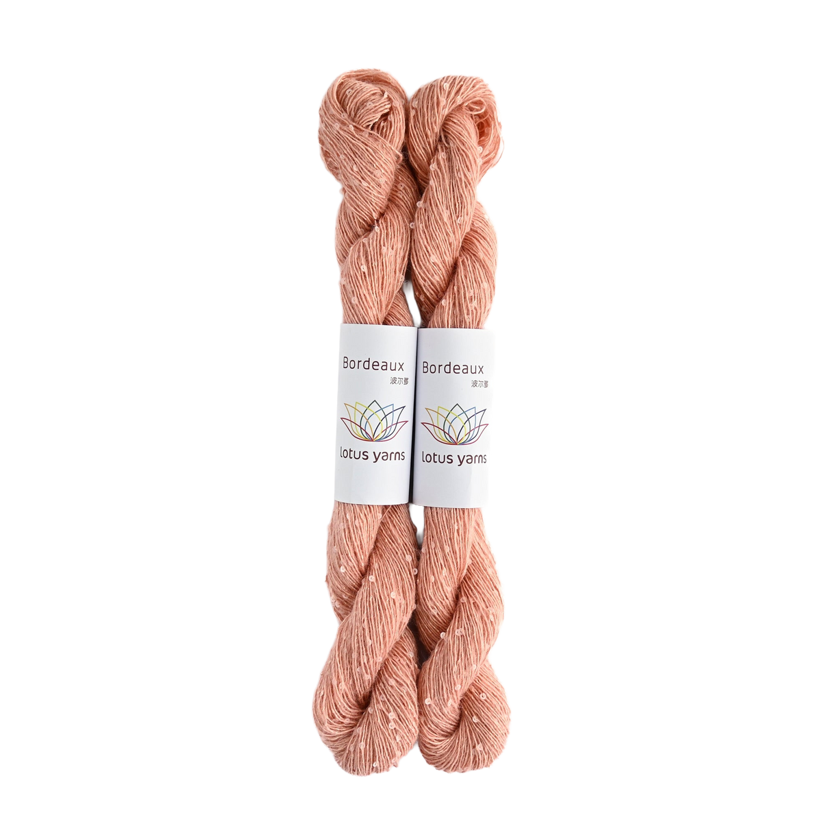 Bordeaux skein with its Lotus Yarns label, cut out